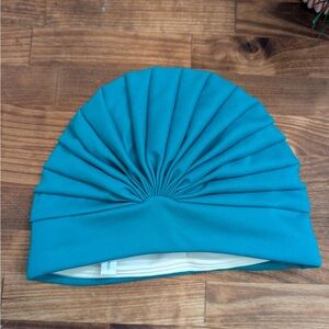 Vintage turquoise bathing cap. Cute swim cap with pleating front.  One size.